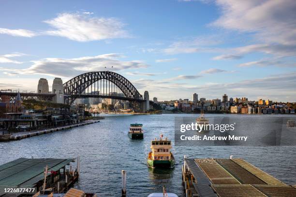 sydney harbour bridge and circular quay ferry wharf, australia - sydney harbour stockfoto's en -beelden