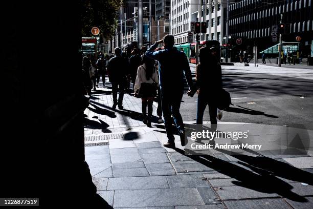 group of people walking on city street during coronavirus pandemic, australia - sydney coronavirus stock pictures, royalty-free photos & images