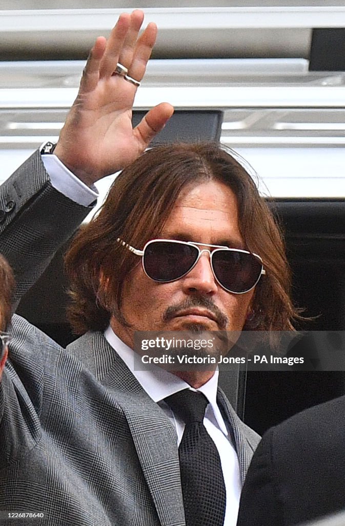 Actor Johnny Depp leaves the High Court in London during his libel Actor Johnny Depp leaves the High Court in London during his libel