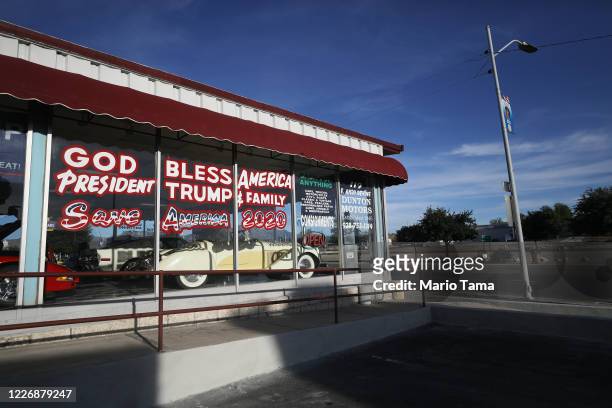 An automobile shop displays a sign supporting President Donald Trump along historic Route 66 amid the coronavirus pandemic on May 24, 2020 in...