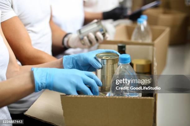 sorting groceries - food bank box stock pictures, royalty-free photos & images