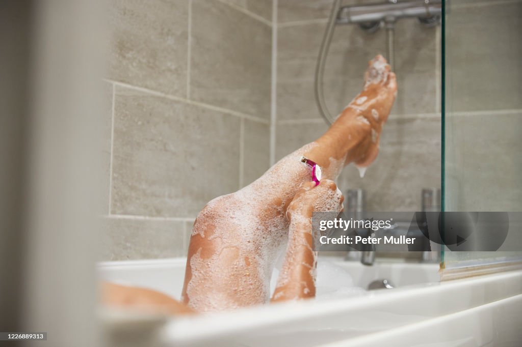 Woman grooming herself at home