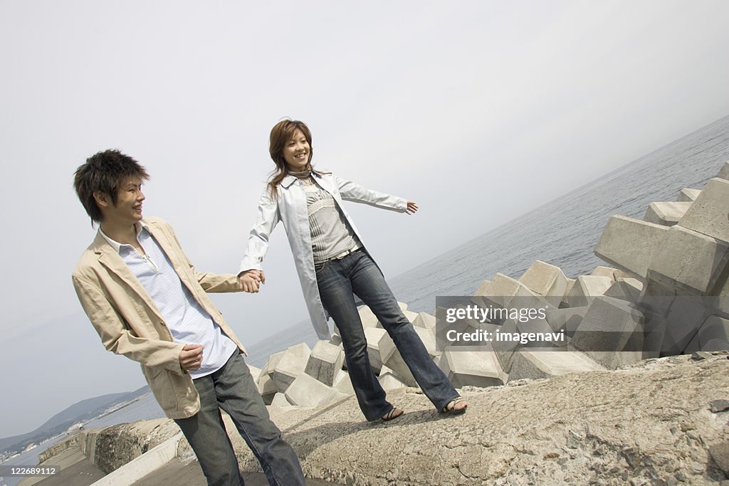 Couple standing at river bank