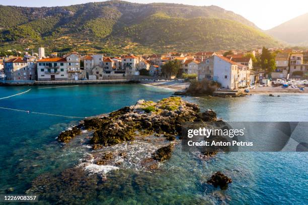 aerial view of the fishing village komiza on vis island in croatia. - vis croatia stock pictures, royalty-free photos & images