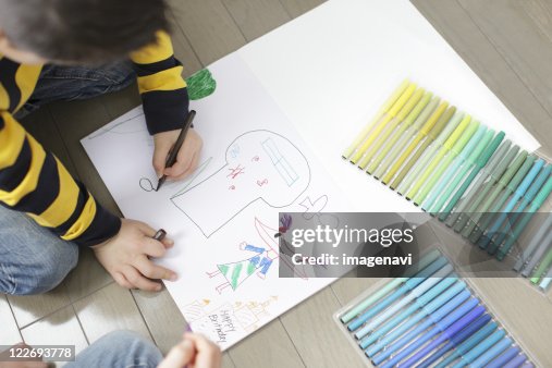 Children writing graffiti Children writing graffiti