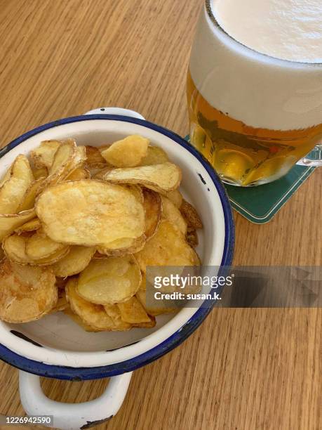 having czech beer and chips for light snack - cereal bar fotografías e imágenes de stock