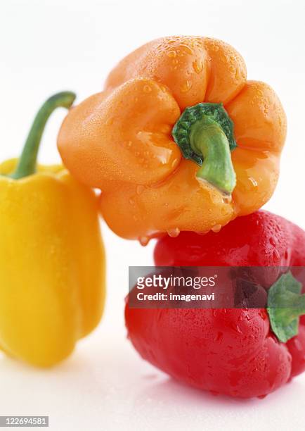 paprika - oranje paprika stockfoto's en -beelden