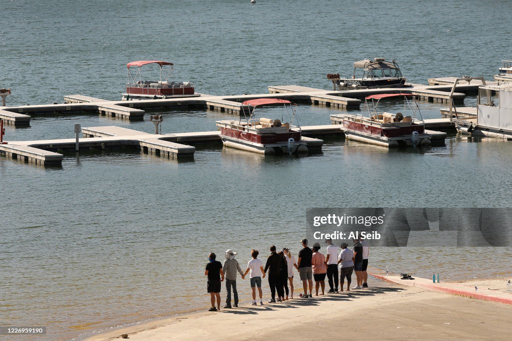 Cast members from the show "Glee" and friends gathered Monday morning at the boat launch as Ventura County Sheriff's Search and Rescue dive team located a body Monday morning in Lake Piru as the search continued for actress Naya Rivera after her 4-year-old