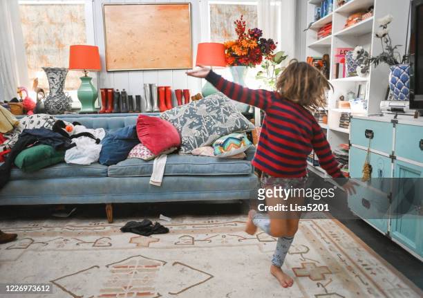 wild kid in a messy domestic home, chaos and childhood - messy room stock pictures, royalty-free photos & images