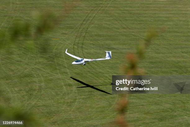 Glider from London Gliding club comes into land over the Chiltern Hills on May 25, 2020 in Dunstable Downs, England. The British government has...