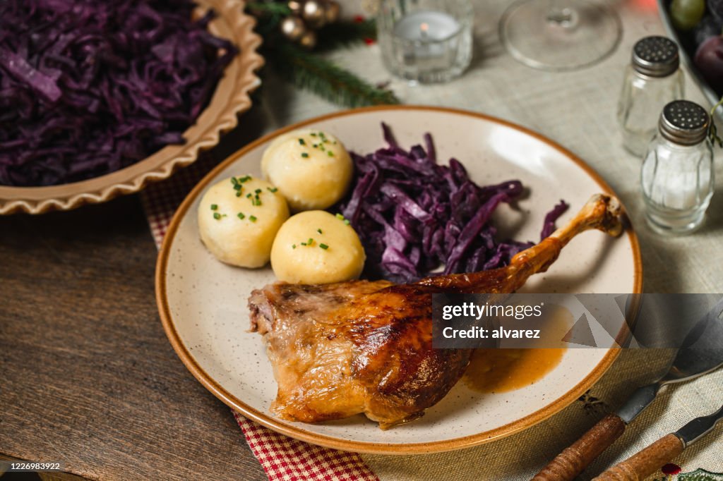Delicious roast duck with red cabbage and dumplings