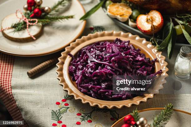 red cabbage served on dining table - red cabbage stock pictures, royalty-free photos & images