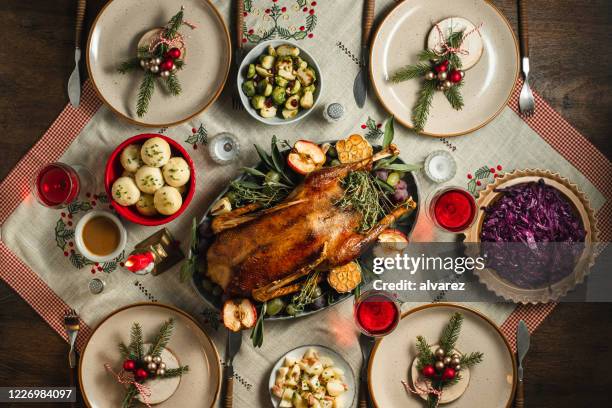 traditional german christmas dinner - dinner table stock pictures, royalty-free photos & images