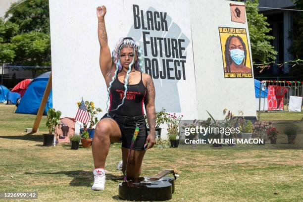 Activist and singer-songwriter Paris Draper poses during a photo session in Grand Park, in downtown Los Angeles, July 3 in Los Angeles, California....