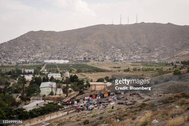 Homeless people, often addicted to opium and other narcotics, gather on the outskirts of Kabul, Afghanistan, on Sunday, July 12, 2020. Covid-19 is...