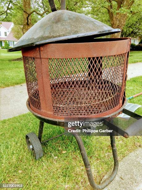 vintage fire pit on curb - fancy outdoor fireplace stock pictures, royalty-free photos & images