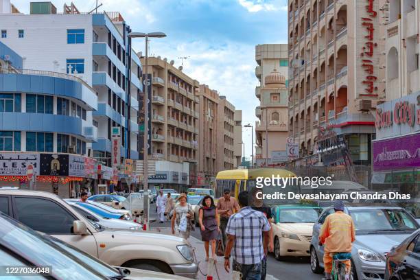 dubai, united arab emirates - the crowded old city downtown district of bur dubai; in view al fahidi street with bumper to bumper traffic - bur al arab stock pictures, royalty-free photos & images
