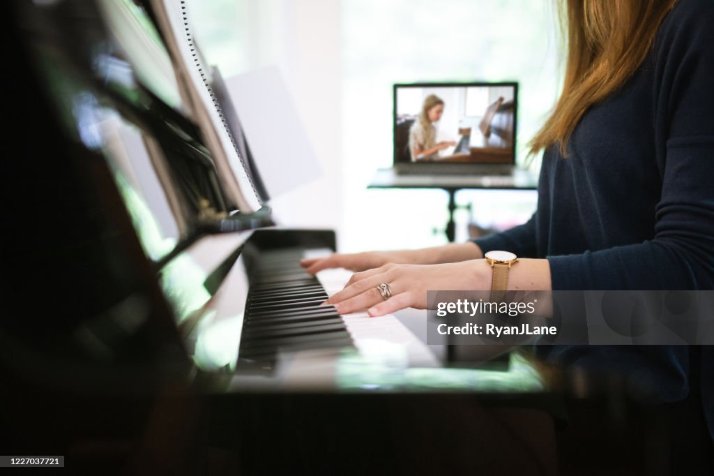 Piano Teacher Instructs Student Via Teleconferencing