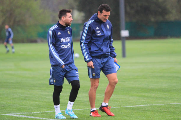 Lionel Messi talks to Lionel Scaloni technical assistant of Argentina during a training session on March 03, 2017 in Ezeiza, Argentina.