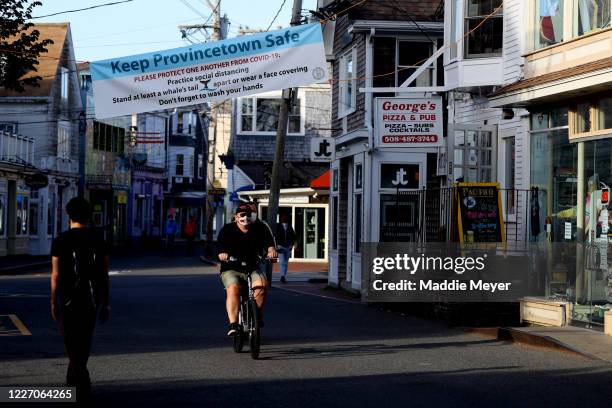 Biker rides down Commercial Street on May 25, 2020 in Provincetown, Massachusetts. Massachusetts has begun Phase 1 of reopening after the coronavirus...