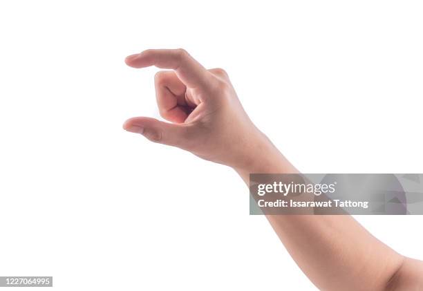 female manicured hand measuring invisible items, woman's palm making gesture while showing small amount of something on white isolated background, side view, close-up, cutout, copy space - holding card stock pictures, royalty-free photos & images