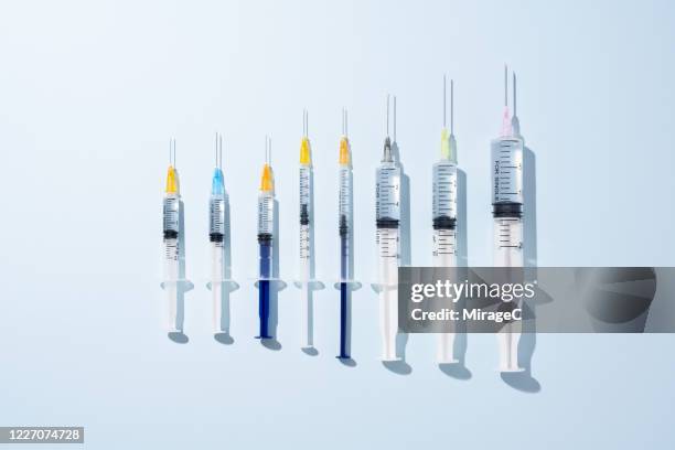 a variety of syringes - seringa imagens e fotografias de stock