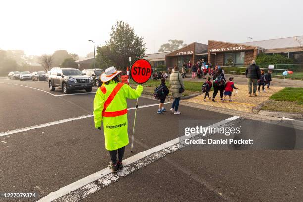 Students arrive for the first day back at Lysterfield Primary School on May 26, 2020 in Melbourne, Australia. Students from prep to year two and...