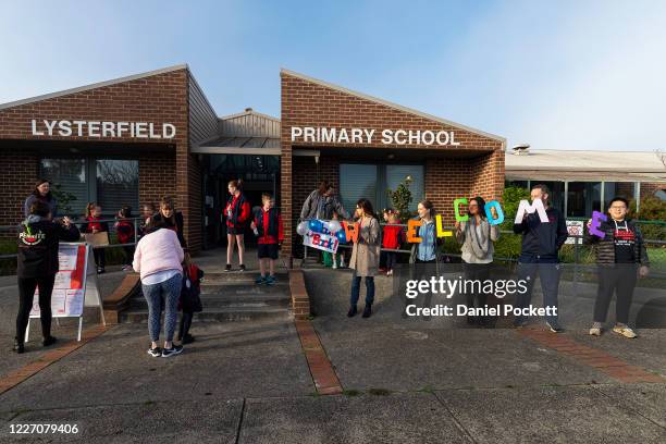 Students arrive for the first day back at Lysterfield Primary School on May 26, 2020 in Melbourne, Australia. Students from prep to year two and...