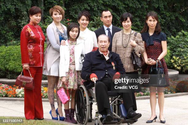 Hong Kong-Macao business magnate Stanley Ho poses with families for a photo on November 20, 2010 in Hong Kong, China.