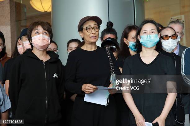 Family members of Macao casino tycoon Stanley Ho Hung-sun speak to media outside Hong Kong Sanatorium and Hospital where Stanley Ho died on May 26,...