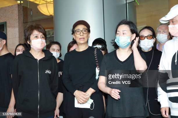 Family members of Macao casino tycoon Stanley Ho Hung-sun speak to media outside Hong Kong Sanatorium and Hospital where Stanley Ho died on May 26,...