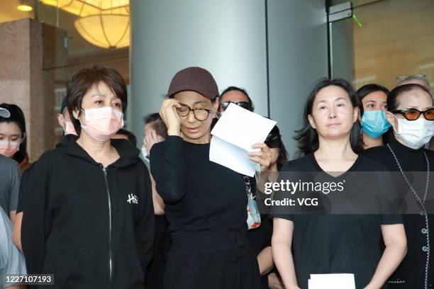 Family members of Macao casino tycoon Stanley Ho Hung-sun speak to media outside Hong Kong Sanatorium and Hospital where Stanley Ho died on May 26,...