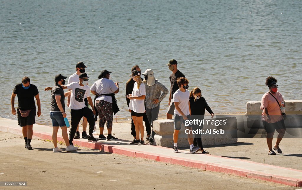 Cast members from the show Glee and friends gathered Monday morning at the boat launch as Ventura County Sheriffs Search and Rescue dive team located a body Monday morning in Lake Piru as the search continued for actress Naya Rivera after her 4-year-old so