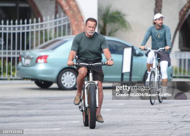 Arnold Schwarzenegger and his son Patrick Schwarzenegger are seen on July 14, 2020 in Los Angeles, California.