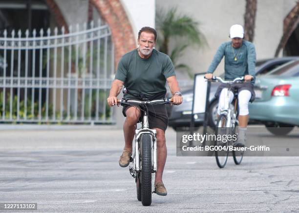 Arnold Schwarzenegger and his son Patrick Schwarzenegger are seen on July 14, 2020 in Los Angeles, California.