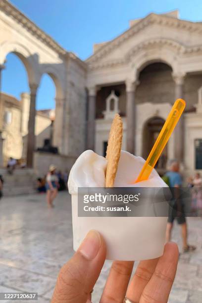 close up of hand holding an ice cream cup - croatia food stock pictures, royalty-free photos & images