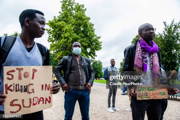 Group of Sudanese men are holding placards during the demonstration against the deportations back to Sudan, in The Hague, Netherlands on July 14th,...