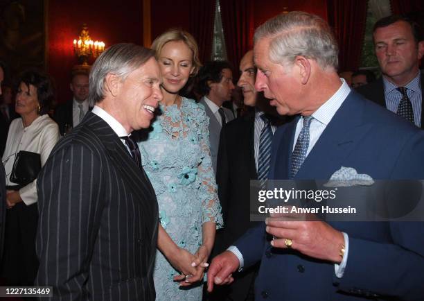 Prince Charles, The Prince of Wales talks with American designer Tommy Hilfiger and his wife Dee during a reception at St James's Palace to launch...