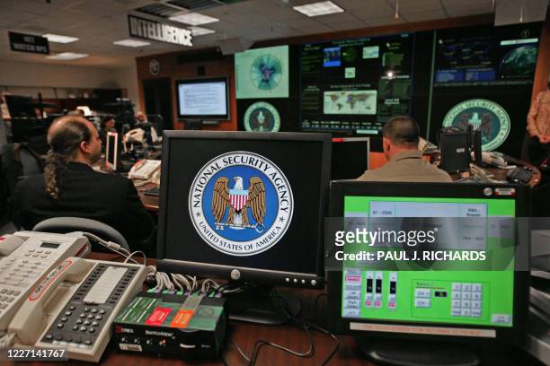Computer workstation bears the National Security Agency logo inside the Threat Operations Center inside the Washington suburb of Fort Meade,...