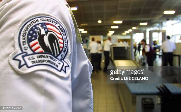 Transportation Security Administration officer looks over passenger security checkpoint during a tour of the Emergency Preparedness and Domestic...