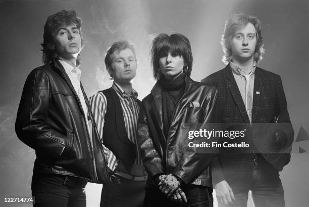 The Pretenders , British rock band, pose for a group studio portrait, against a smoky background, United Kingdom, in January 1979.