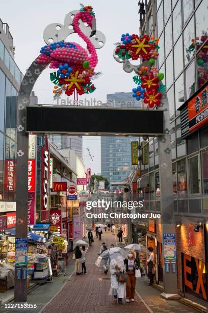 Takeshita Street is seen partially opened with a few people walking through the street on May 26, 2020 in Tokyo, Japan. The Japanese government...