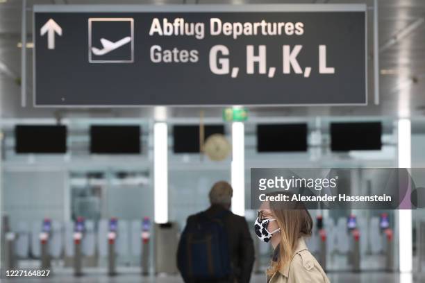 Travellers at the Check-In Area of the Lufthansa Terminal 2 at Munich Franz-Josef-Strauss International Airport during the coronavirus crisis on May...