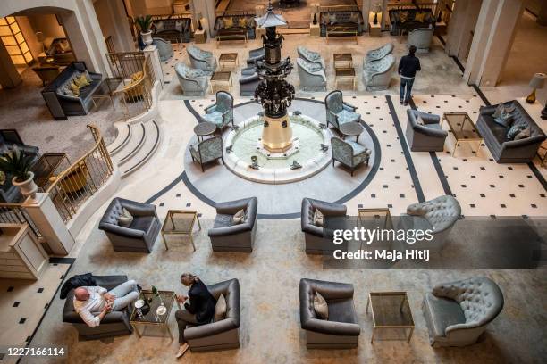 Seats are placed apart to provide social distance at a lobby at the Hotel Adlon Kempinski on May 26, 2020 in Berlin, Germany. As European countries...