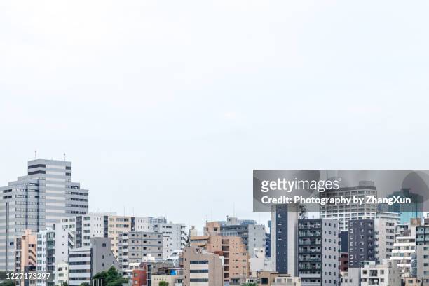 tokyo city waterfront view in tsukishima area, koto ward, japan at day time. - japan street stock pictures, royalty-free photos & images
