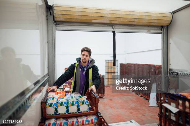 stacking on his shift - loading groceries stock pictures, royalty-free photos & images
