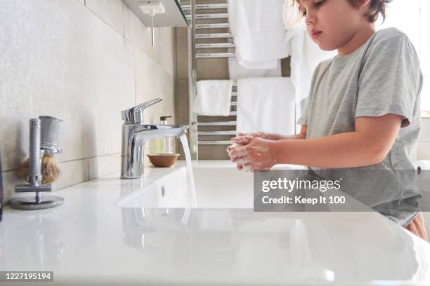 child washing their hands - washing hands close up stock pictures, royalty-free photos & images