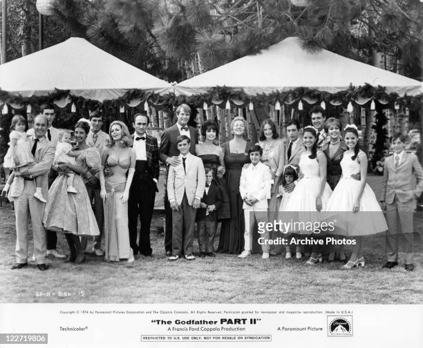Group photo of a portion of the cast at wedding in a scene from the film 'The Godfather: Part II', 1974.