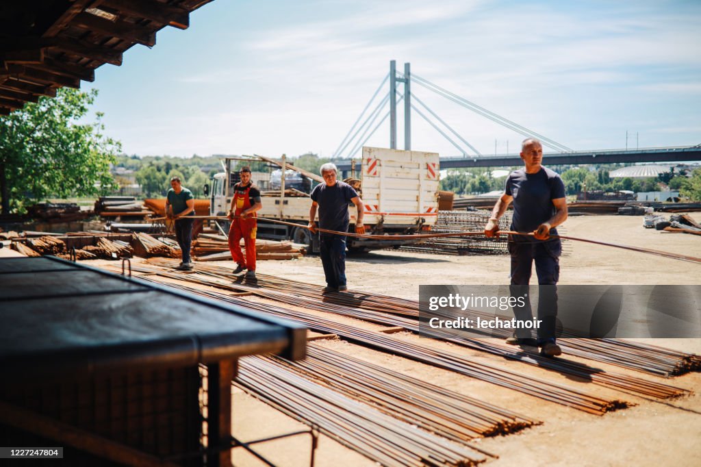 Workers Loading Rebar Into Truck High-Res Stock Photo - Getty Images