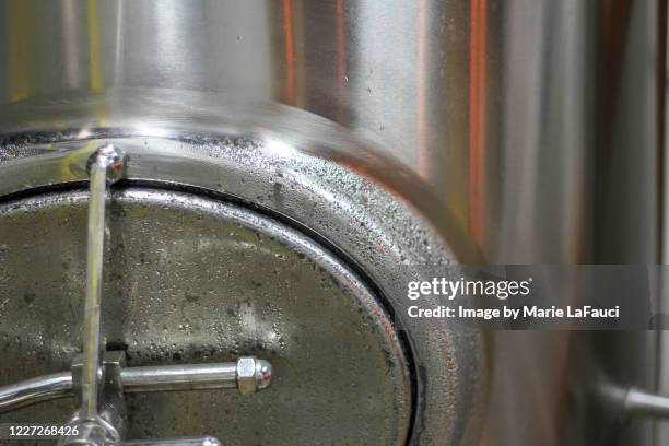 close-up of steel tank at beer microbrewery - latch stock pictures, royalty-free photos & images